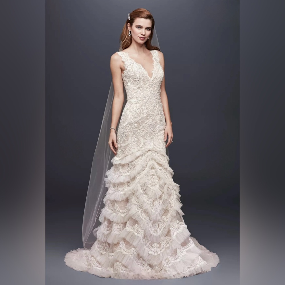 Beaded lace wedding dress with plunging neckline
New / never worn